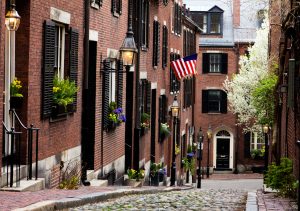 View of the historic architecture of Boston in Massachusetts, USA at Beacon hill showcasing its cobblestone street and colonial buildings on Boston walking tour