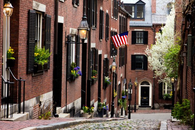 View of the historic architecture of Boston in Massachusetts, USA at Beacon hill showcasing its cobblestone street and colonial buildings on Boston walking tour