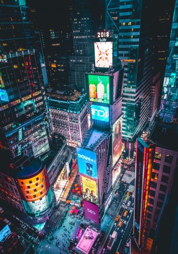 Times-Square-lit-at-night-in-NYC