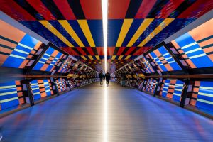 Blue red and yellow striped ceiling tunnel in London