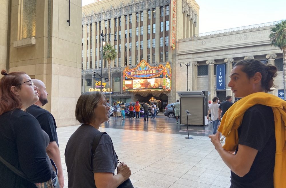 Tour guide talking with guests on the ExperienceFirst Haunted Hollywood Walking Tour