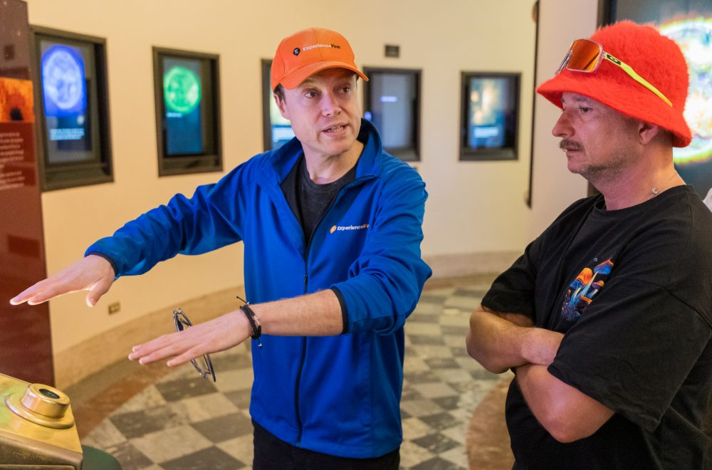 Tour Guide and guest inside Griffith Observatory