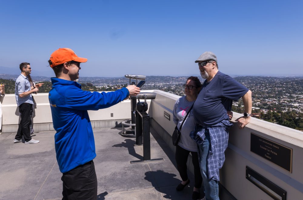 Tour Guide taking photos of guests on Griffith Observatory Guided Tour