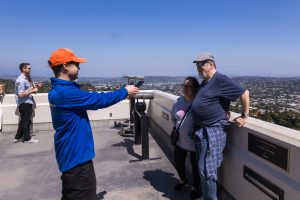 Tour Guide taking photos of guests on Griffith Observatory Guided Tour