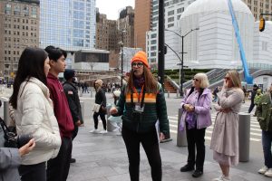Guide with Group on street talking