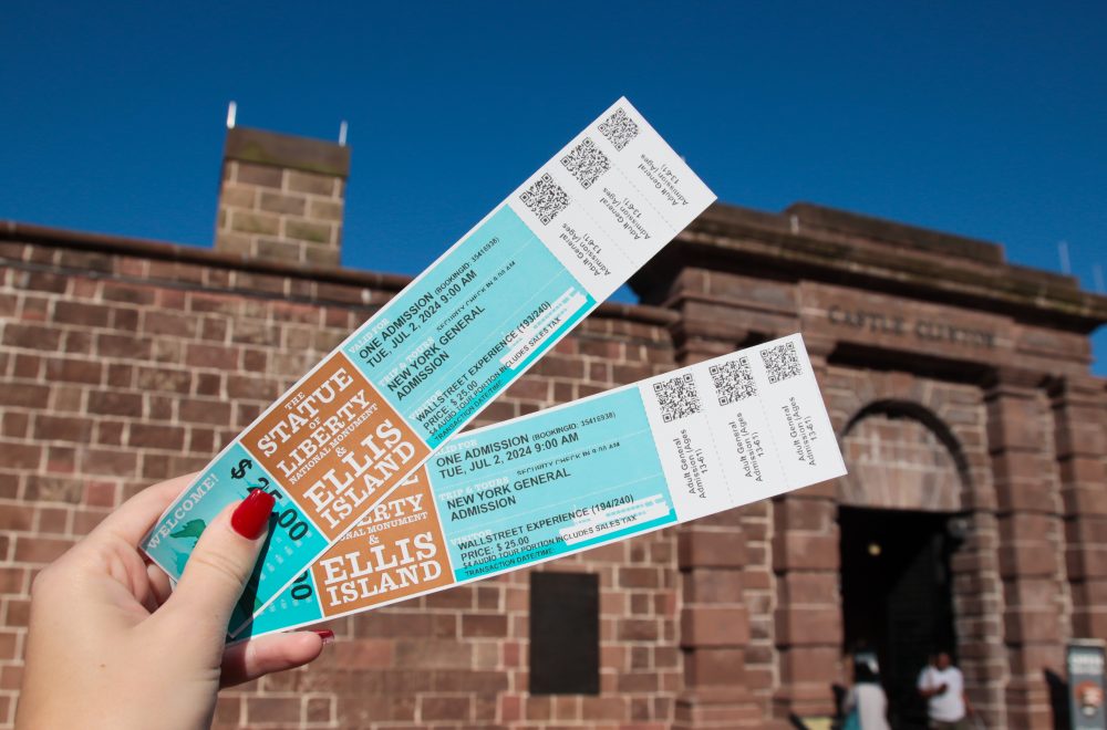 Statue of Liberty and Ellis Island admission tickets close up