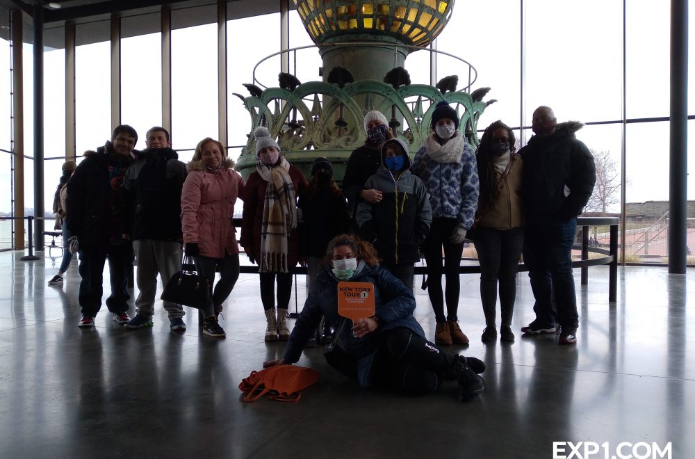 tour group inside the statue of liberty museum