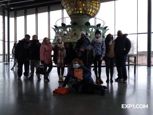 tour group inside the statue of liberty museum