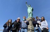 tour group with families at Statue of Liberty