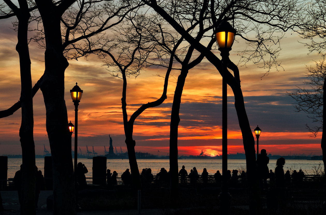 Sunset over a Statue of Liberty.