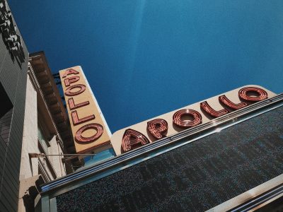 Apollo Theatre sign on Harlem team-building tour