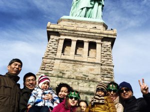 Family at Statue of Liberty on guided tour