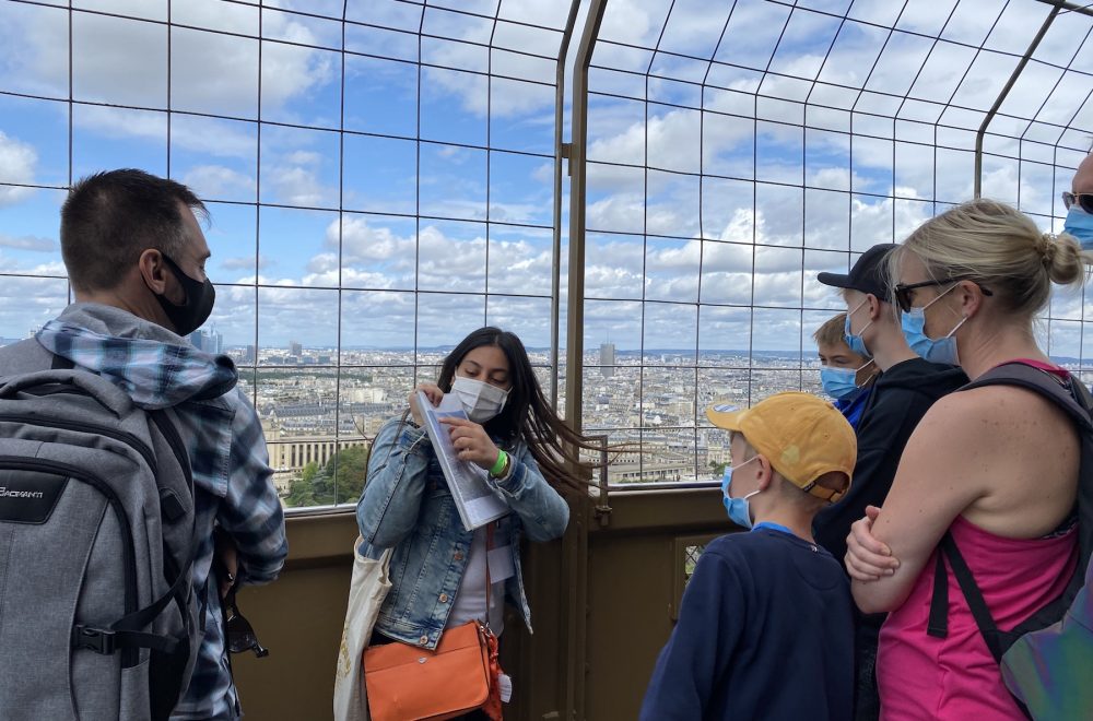 Guide giving tour at Eiffel Tower