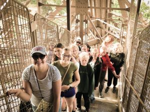 tour group climbing eiffel tower