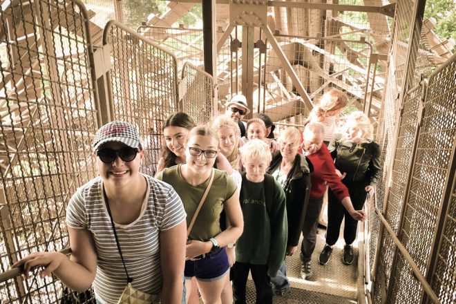 Eiffel Tower guided climb tour group climbing the Eiffel Tower