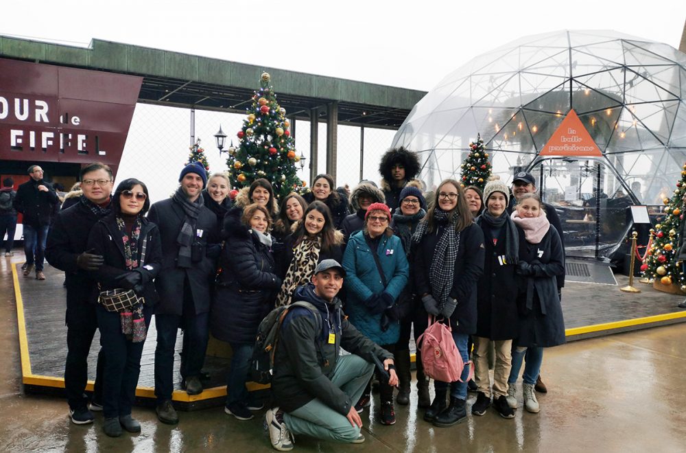 Tour group at Eiffel Tower during the Christmas holidays