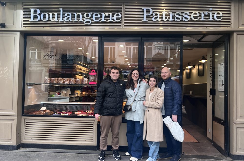 Guests posing in front of bakery