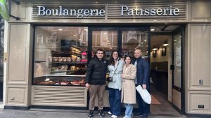 Guests posing in front of bakery