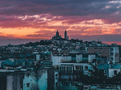 Paris on a hill as shown with Montmartre at dusk