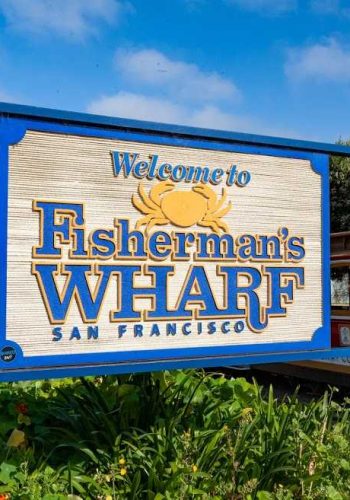 Fisherman's Wharf sign with cable car