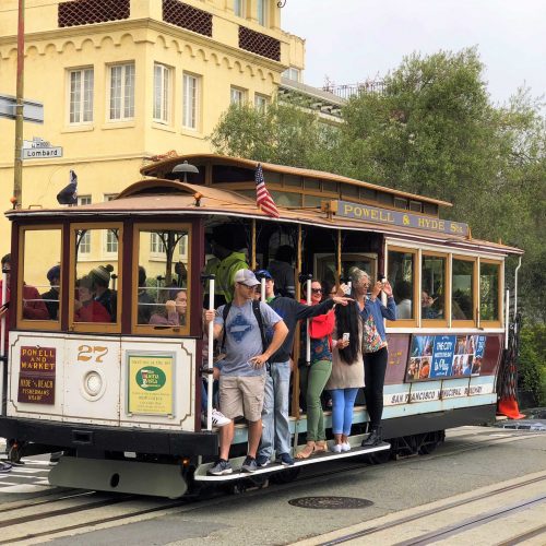 group riding sf cable car