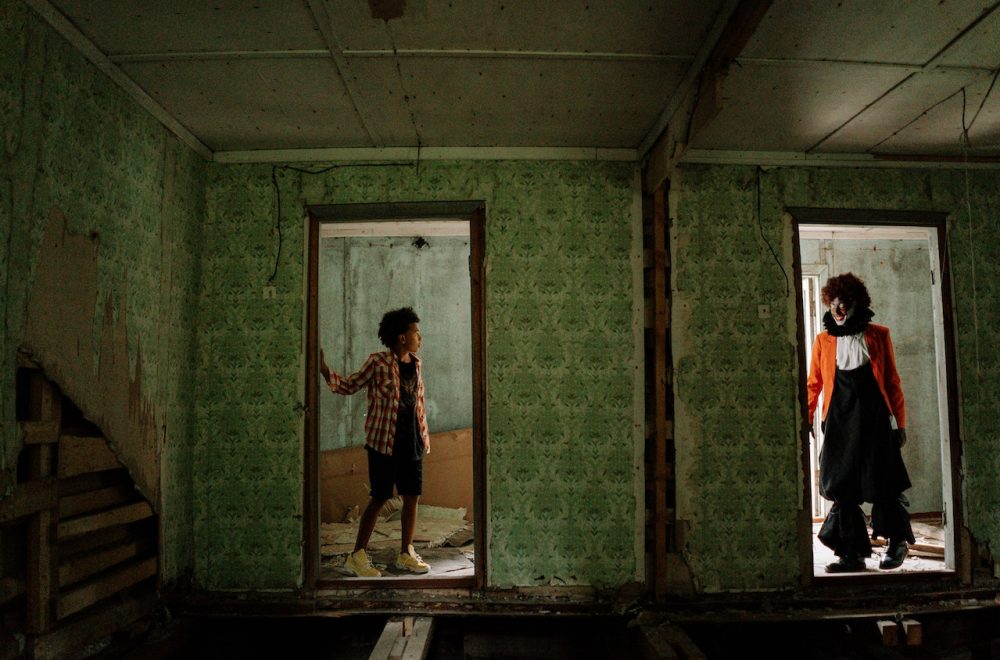 Boy Looking at a Scary Clown