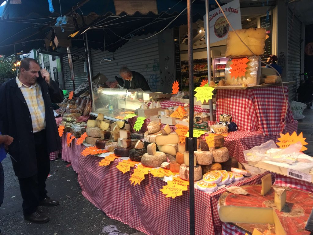 a large table full of many kinds of cheese