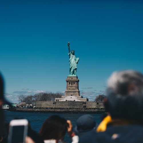 Tourists looking at Statue of Liberty