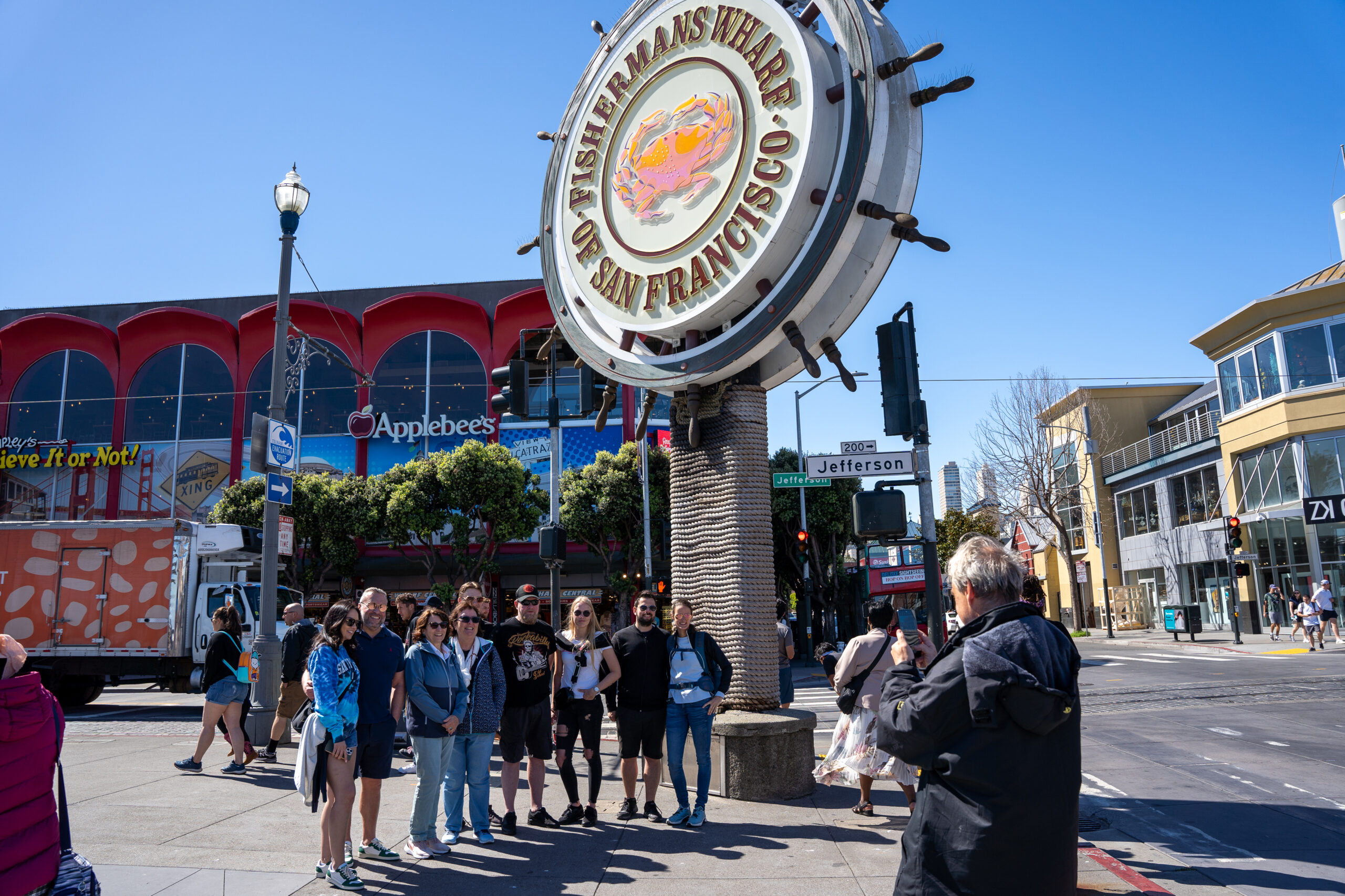 Guide taking group photo during Fisherman's wharf tour