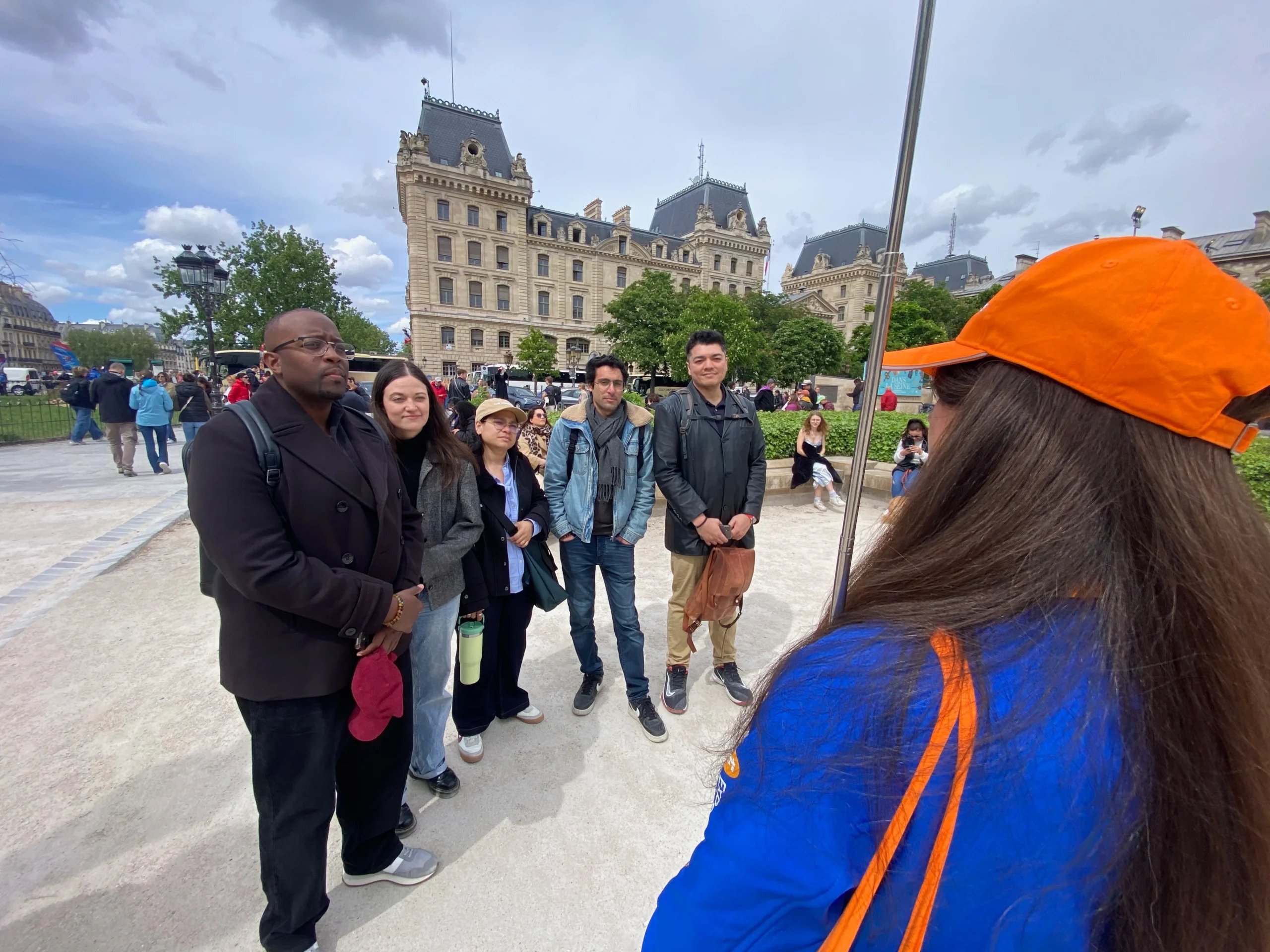 Guests listening to Notre-Dame tour guide in Paris