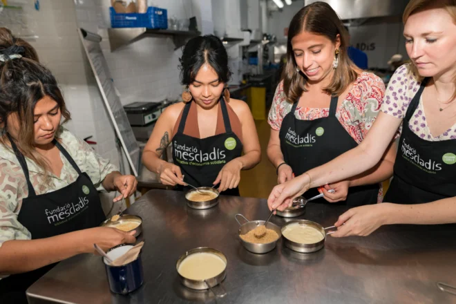 Group cooking dessert during cooking class in Barcelona