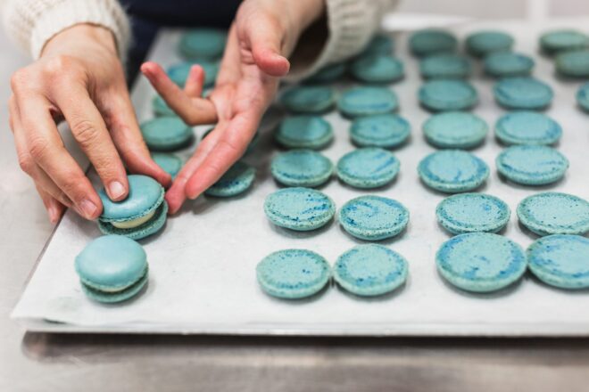 Woman assembling macarons