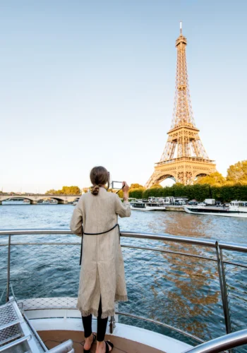 Woman admiring the Eiffel Tower from River Seine Cruise during Private Paris guided tour