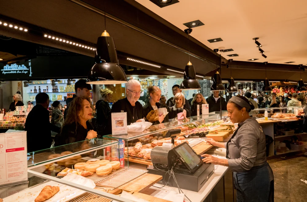 Customers at bakery ordering in Barcelona
