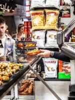 Ima handing out olives for tasting at La Boqueria