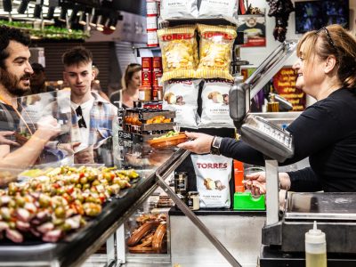 Ima handing out olives for tasting at La Boqueria
