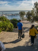 Tour guide and group walking during Montjuic Walking Tour