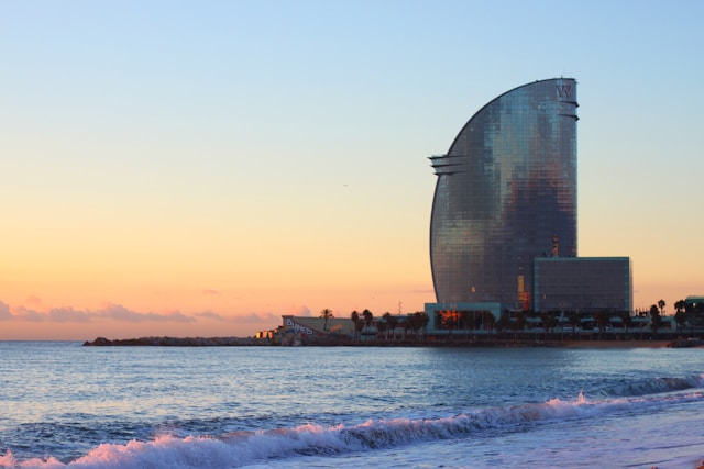 Glass building at sunset on Barcelona beach