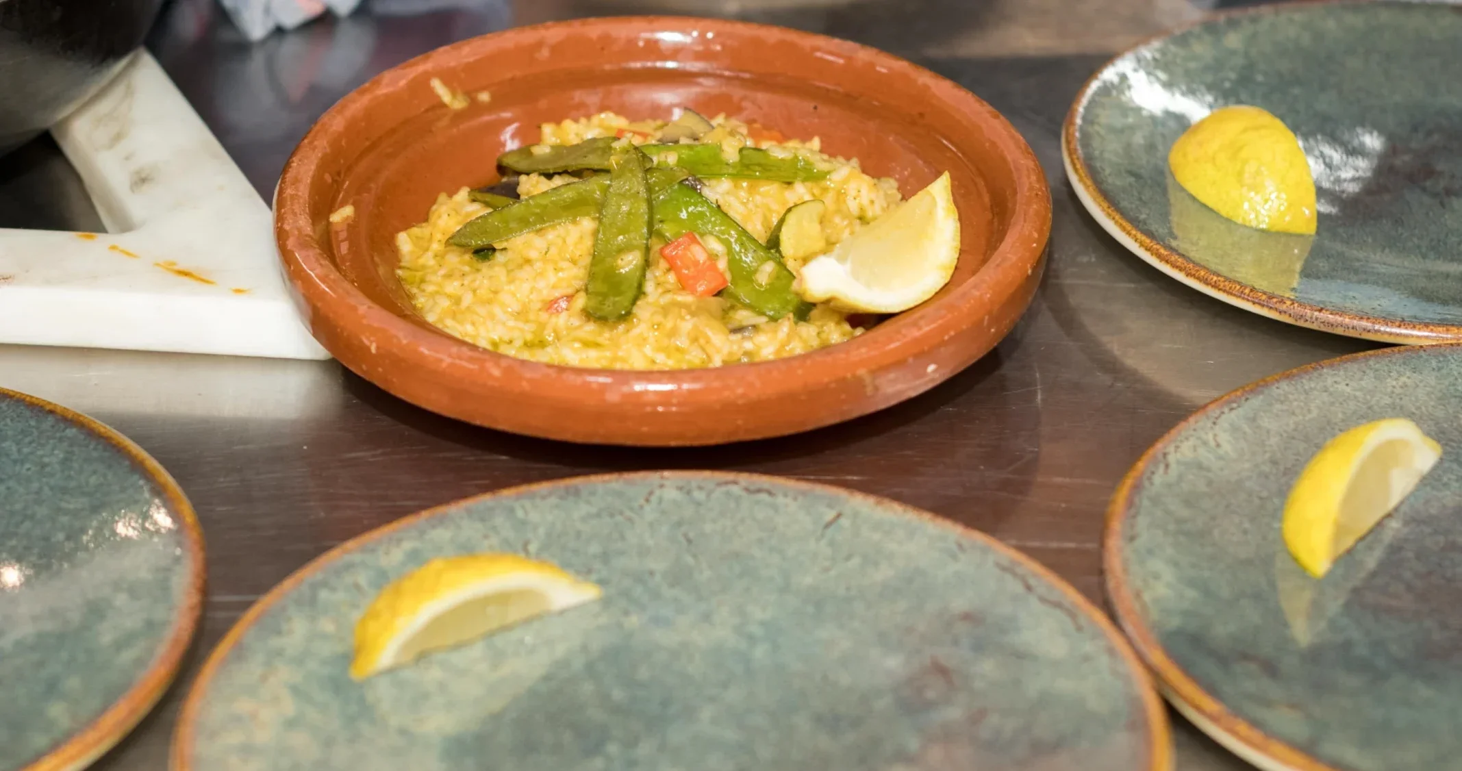 Dishes being plated during cooking class in Barcelona