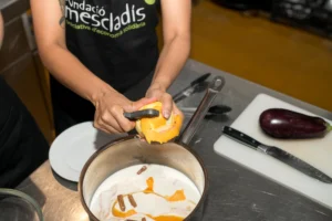 Guest peeling orange rind during cooking class in Barcelona