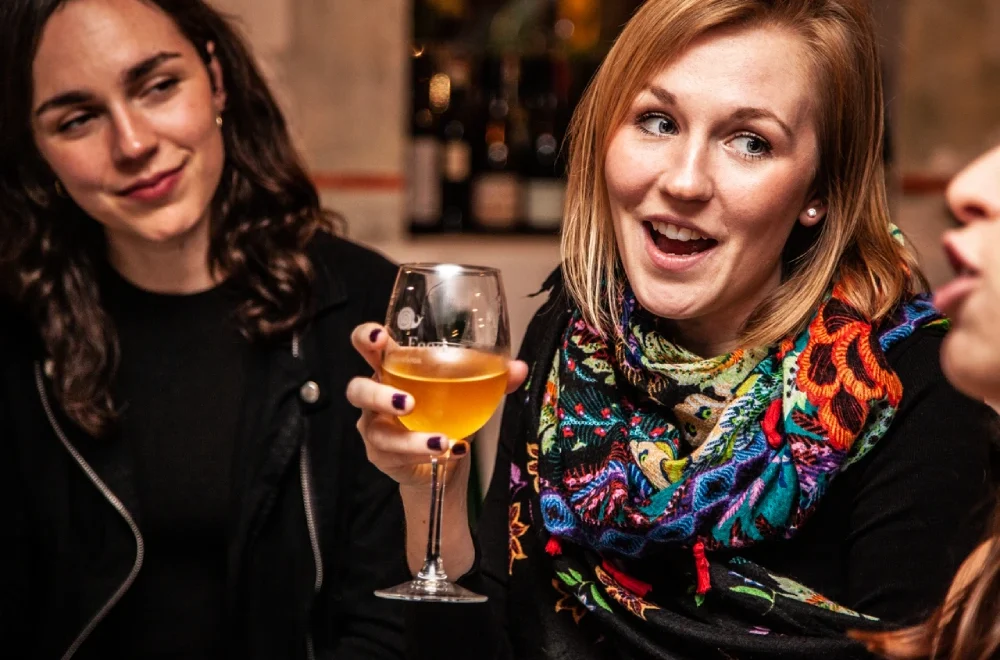 Close up of guests enjoying a glass of wine