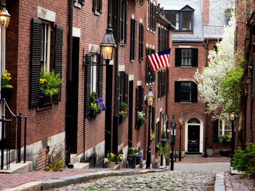 View of the historic architecture of Boston in Massachusetts, USA at Beacon hill showcasing its cobblestone street and colonial buildings on Boston walking tour