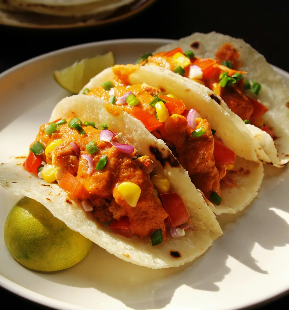 Close up of tacos on white plate