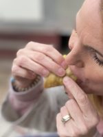 Woman eating Discada taco Austin eastside