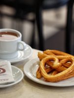Churros and hot chocolate at Chocolatería 1902 in Madrid