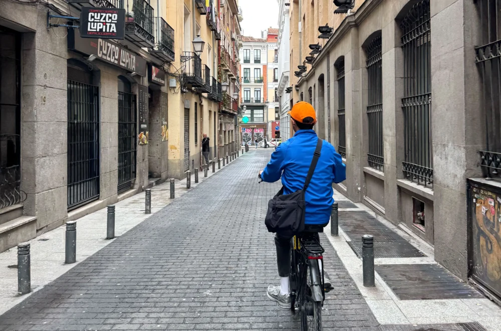 Madrid bike tour guide bicycling through scenic street