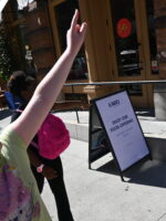 Child pointing at building during Soho, Little Italy and Chinatown tour