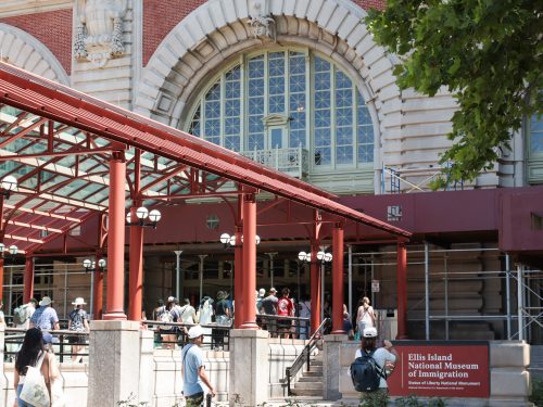 Close up of Ellis Island entrance on a sunny day during Statue of Liberty tour