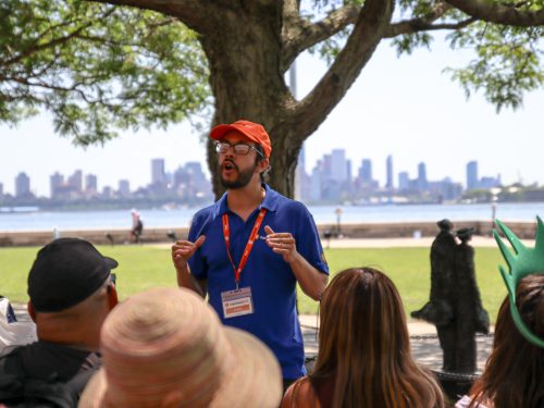 Focused shot of ExperienceFirst tour guide talking to tour group