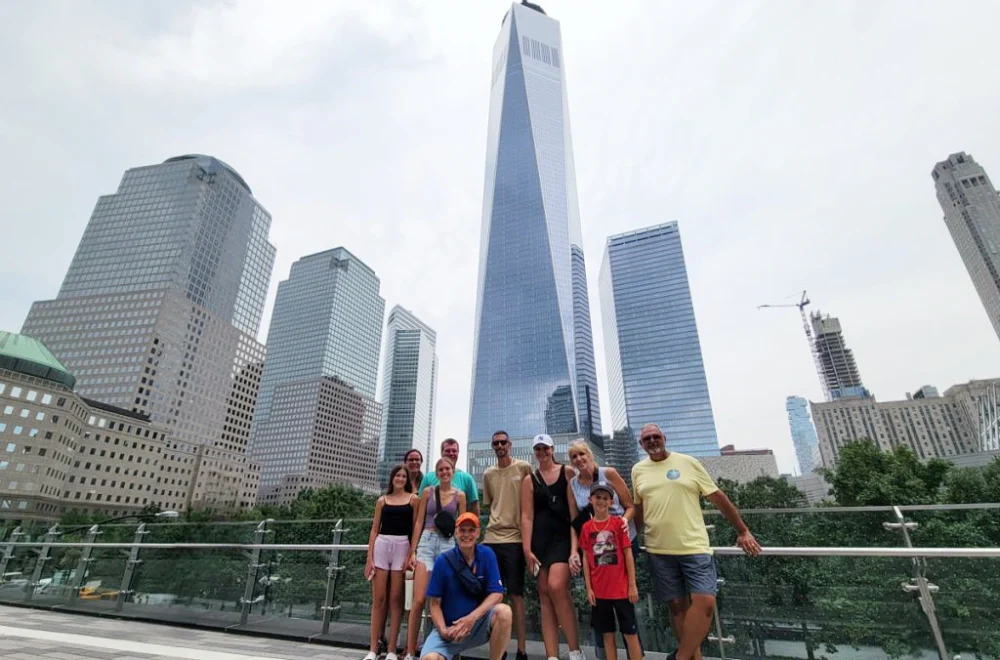 Tour group posing in front of Freedom Tower in NYC